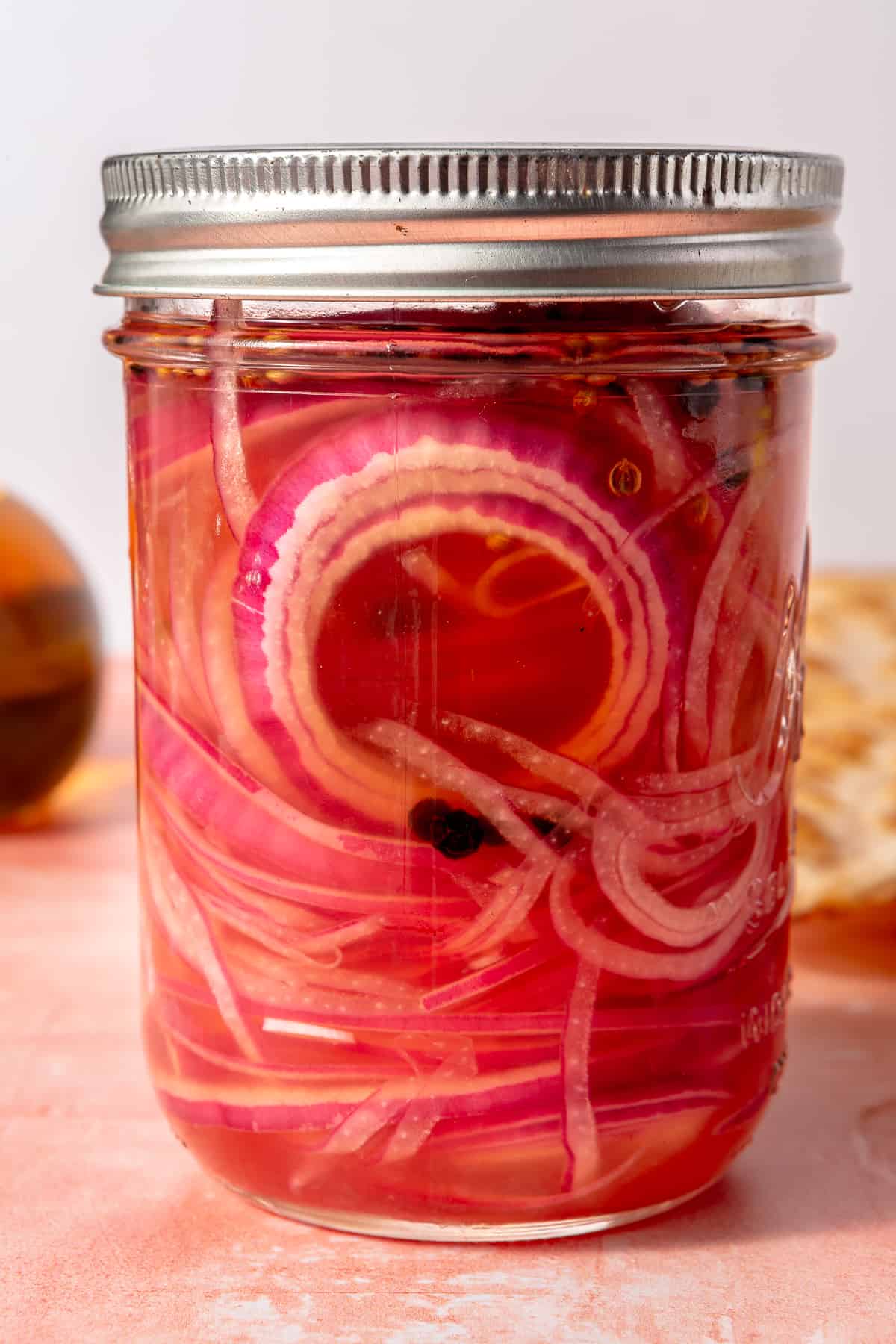 Quick pickled onions in mason jar.