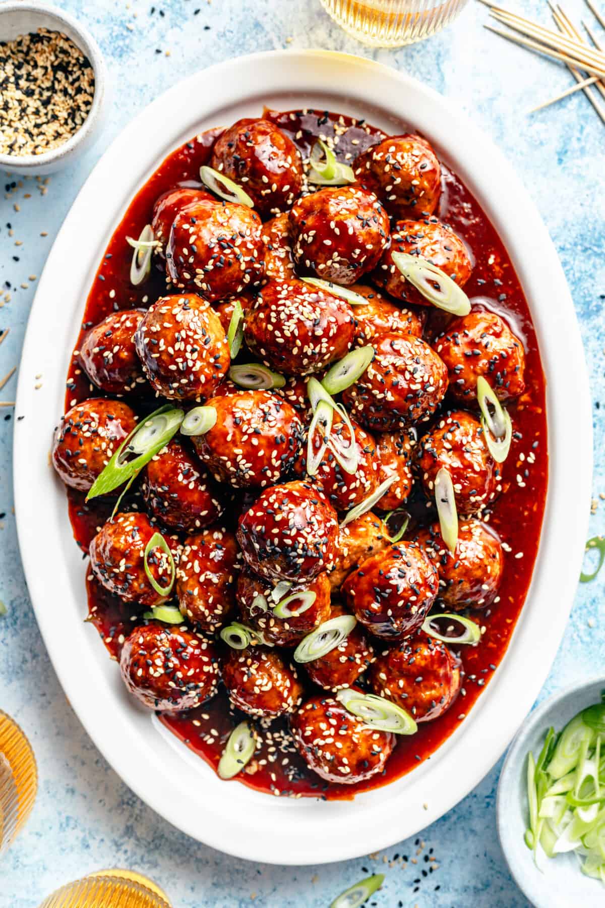 Korean-Inspired BBQ Chicken Meatballs on white oval platter.