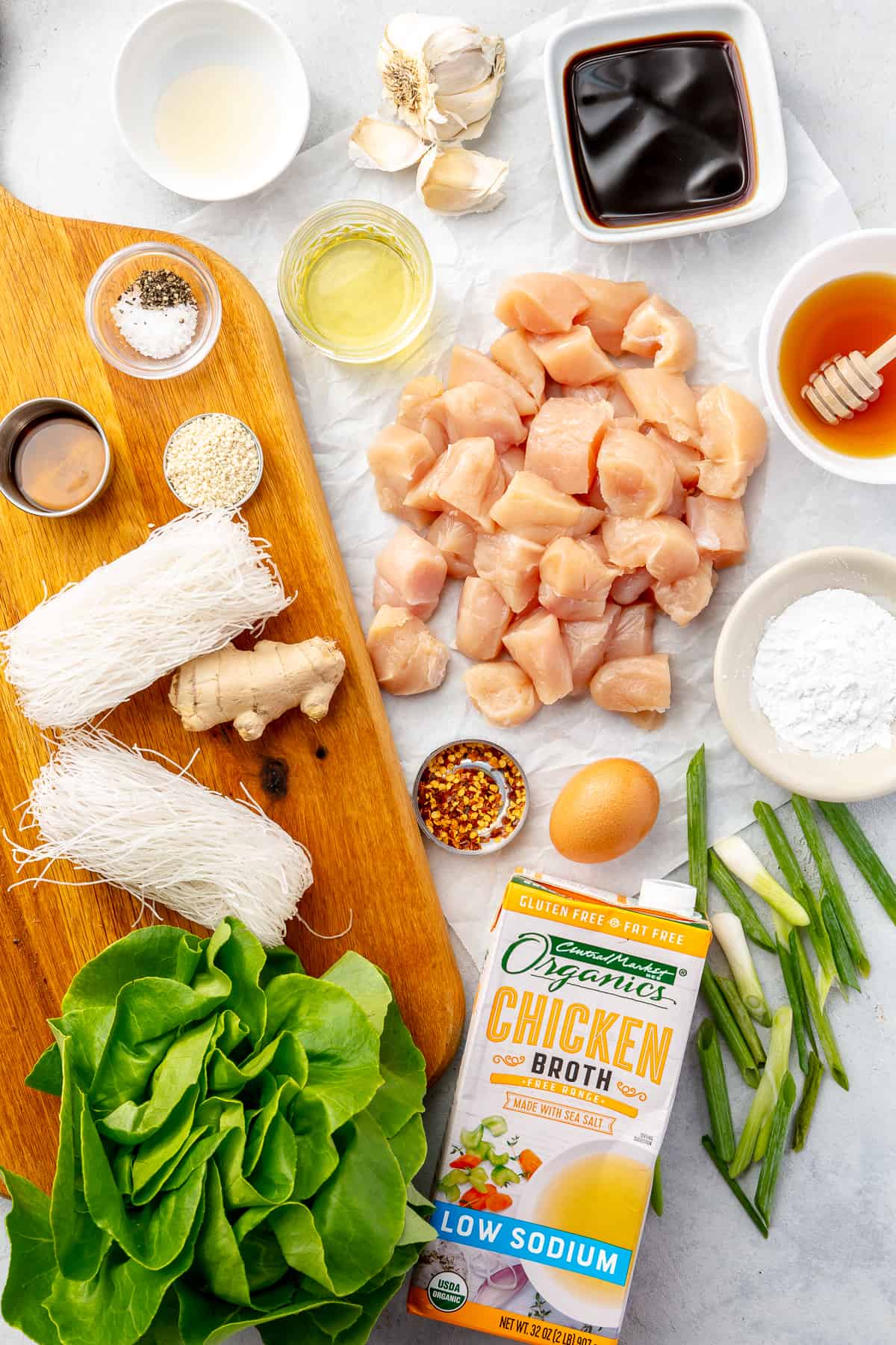 Ingredients for Honey-Garlic Chicken Lettuce Wraps all laying on a flat surface.