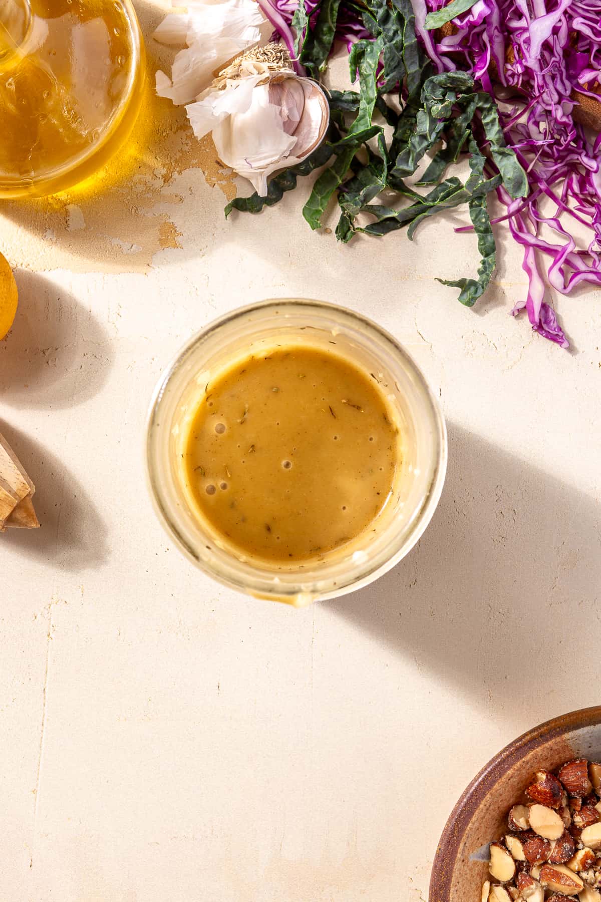 Hot honey dressing in small bowl for Blackened Chicken and Sweet Potato Bowls.