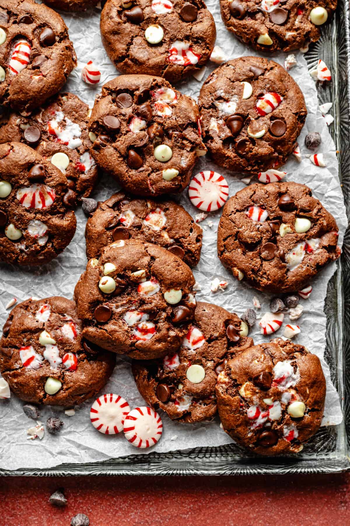 Baked Double Chocolate Peppermint Cookies on a sheet pan lined with parchment paper.