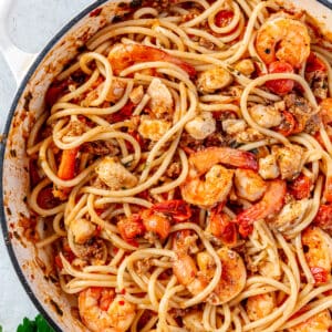Pasta tossed with sauce and all of the seafood.