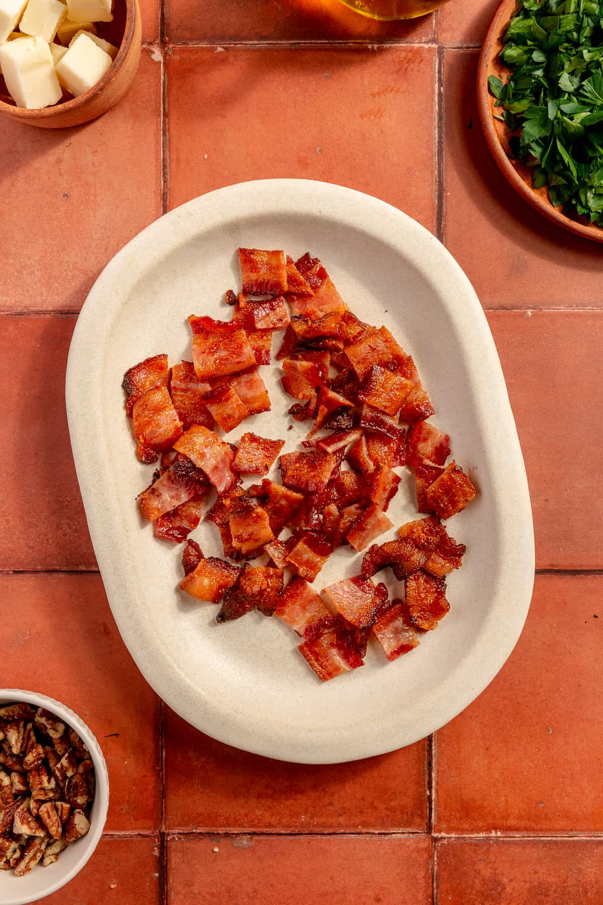 Chopped bacon on small plate.