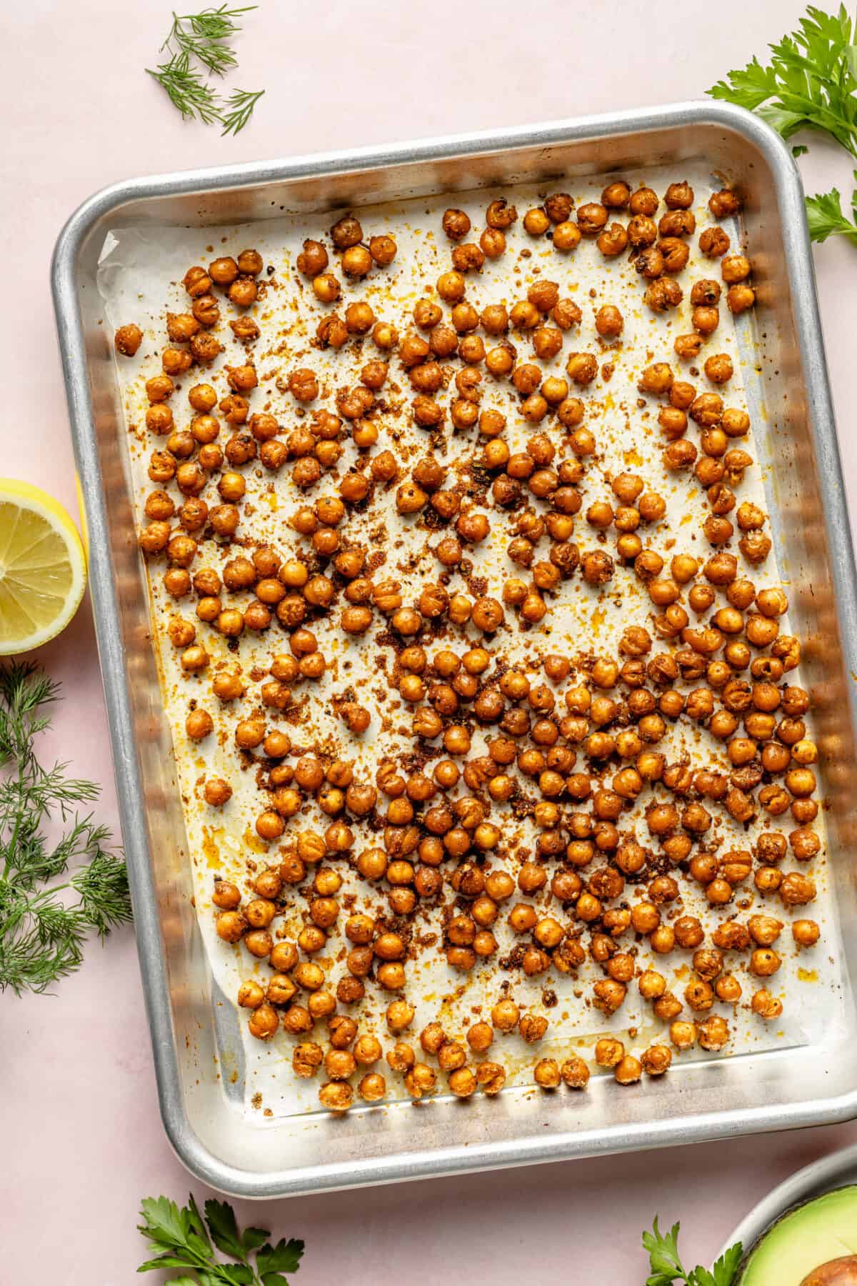 Crispy chickpeas on parchment lined sheet pan.