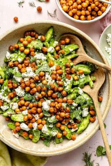 Cucumber Salad with Crispy Chickpeas in a large bowl with crispy chickpeas scattered around.