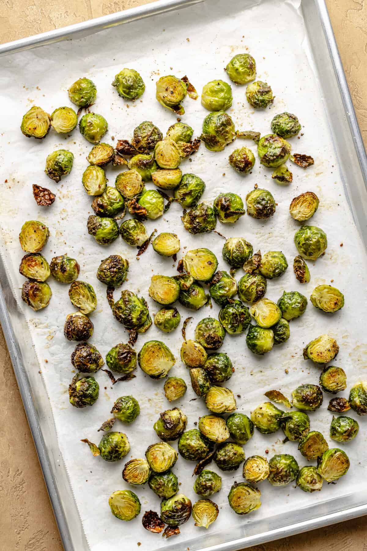 Roasted brussels sprouts on sheet pan.