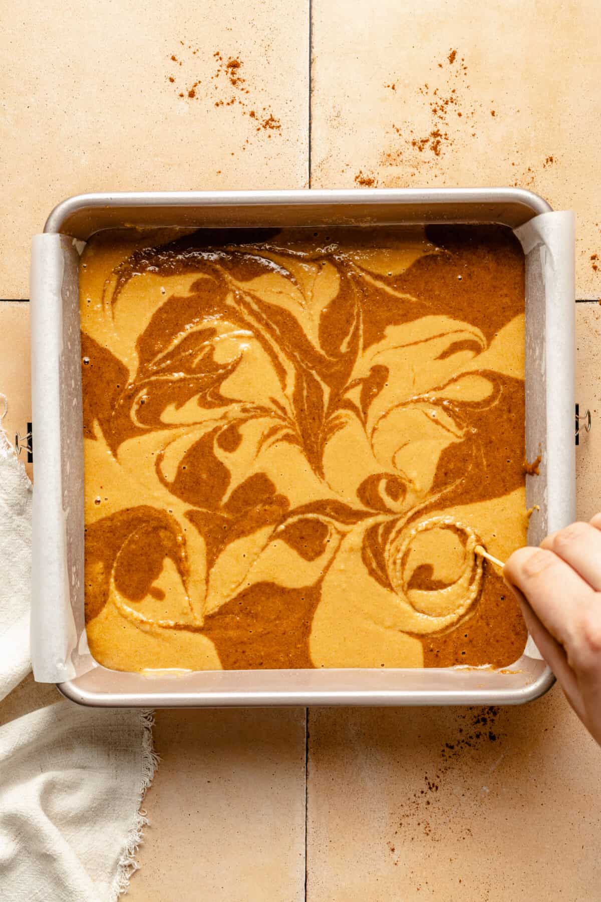 Paleo Cinnamon Swirl Cake batter swirled in pan.