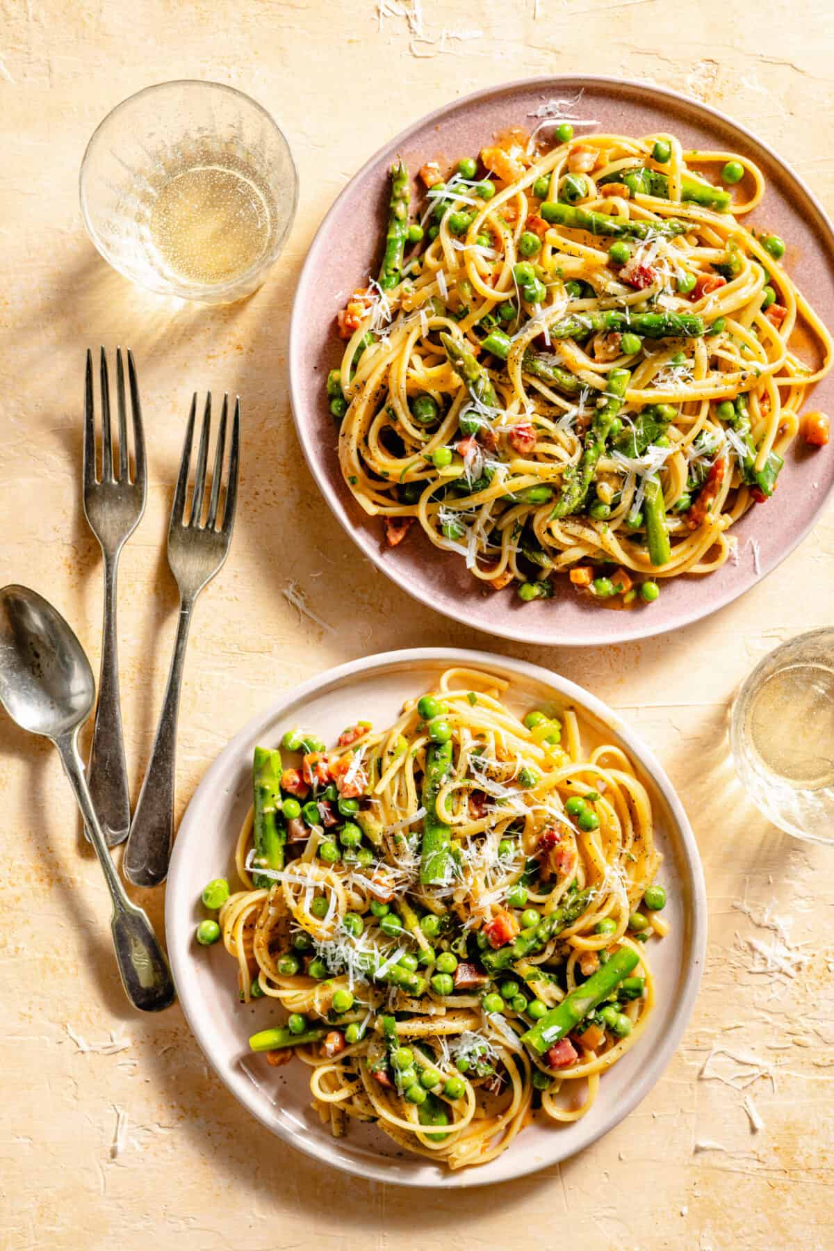 Spring Spaghetti Carbonara on two pink plates.
