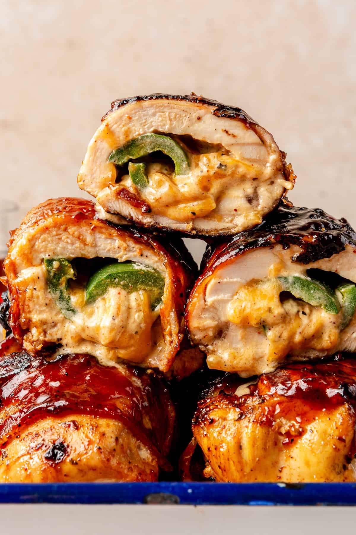 Grilled Jalapeño Popper Chicken stacked on top of one another.