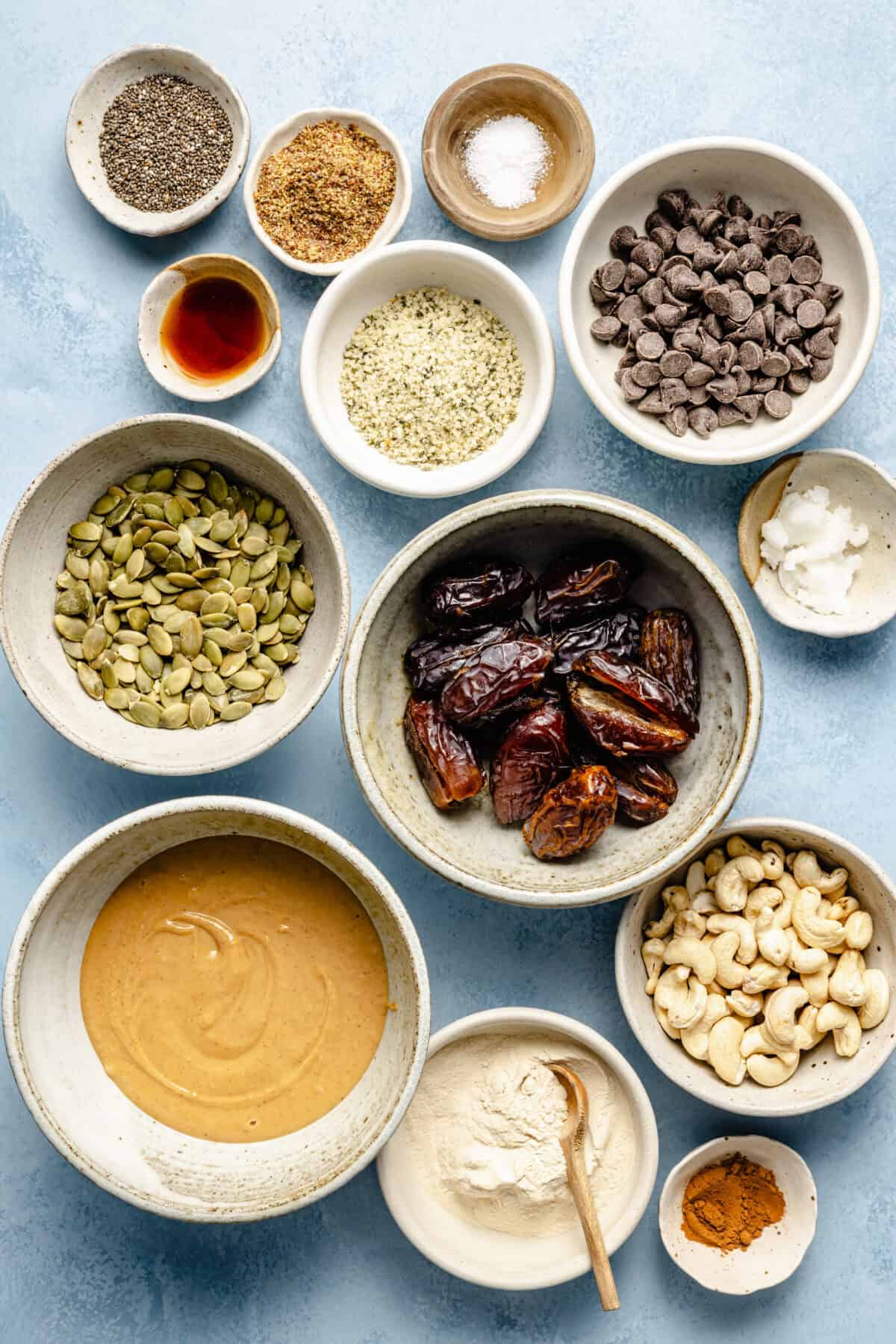 ingredients for protein and fiber buckeye balls on a light blue background