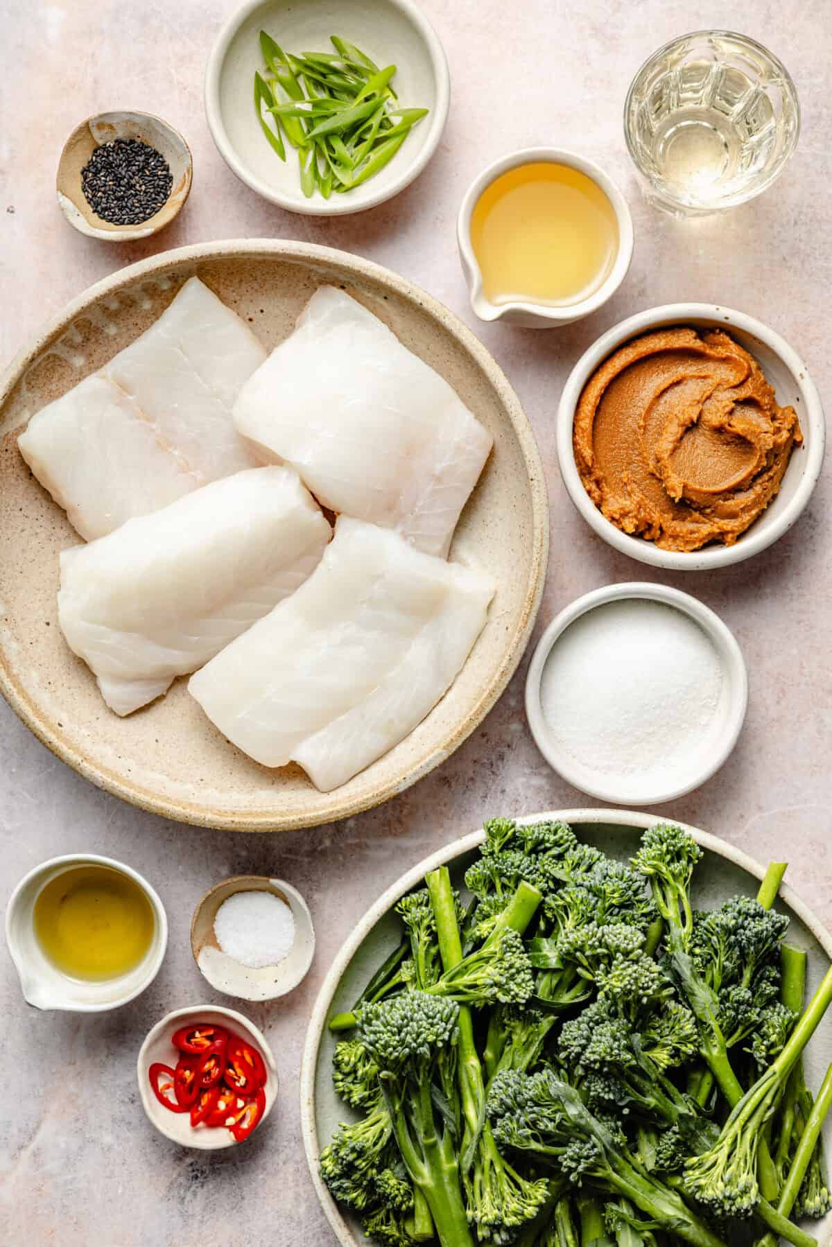 a flat-lay of ingredients for sheet pan miso marinated cod with broccolini