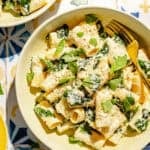 Creamy Lemon Pasta with Ricotta and Basil in a bowl on a tiled surface.