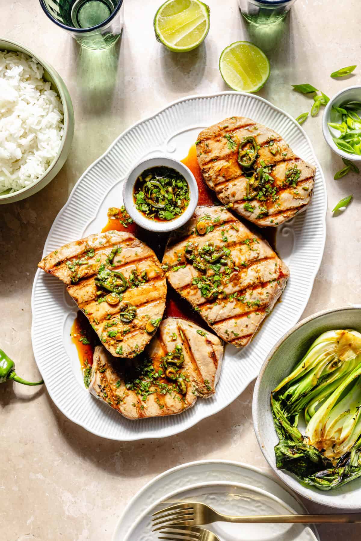 Grilled Ahi Tuna with Ponzu-Lime Marinade on platter with additional serving items around it.