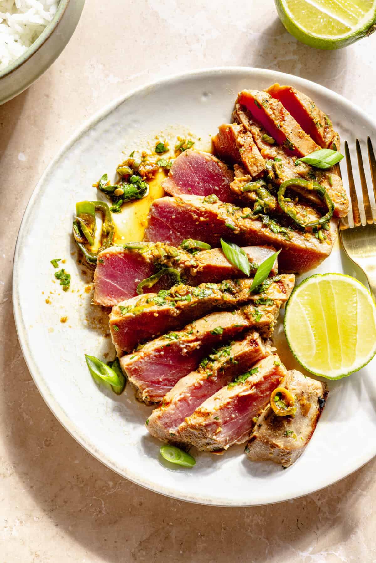 Grilled Ahi Tuna with Ponzu-Lime Marinade sliced on plate.