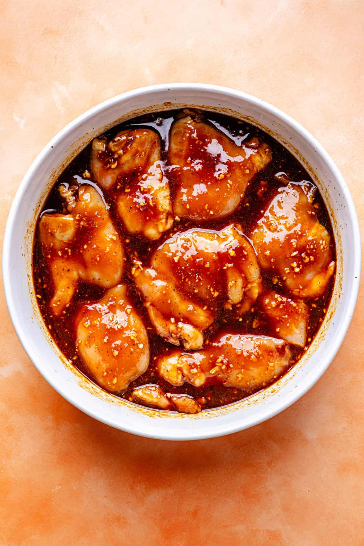 Huli Huli–Inspired Chicken marinading in bowl.
