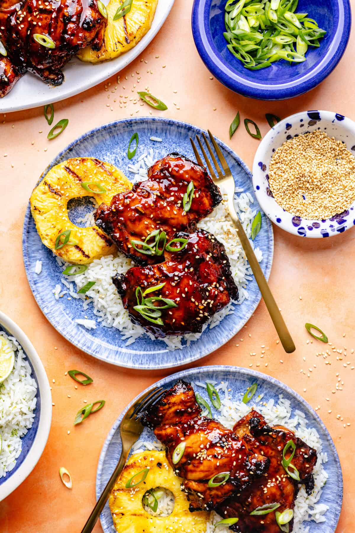 Grilled Huli Huli–Inspired Chicken in bowl with rice and grilled pineapple.