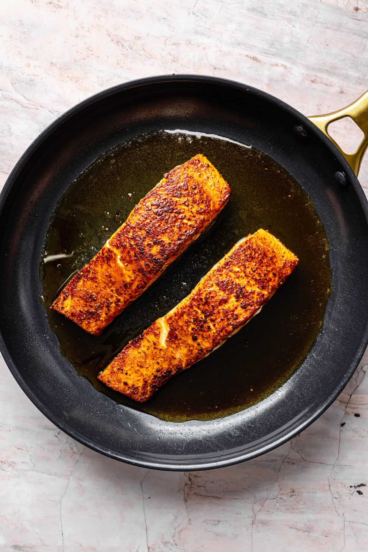 Pan-Seared Salmon in cast iron skillet.