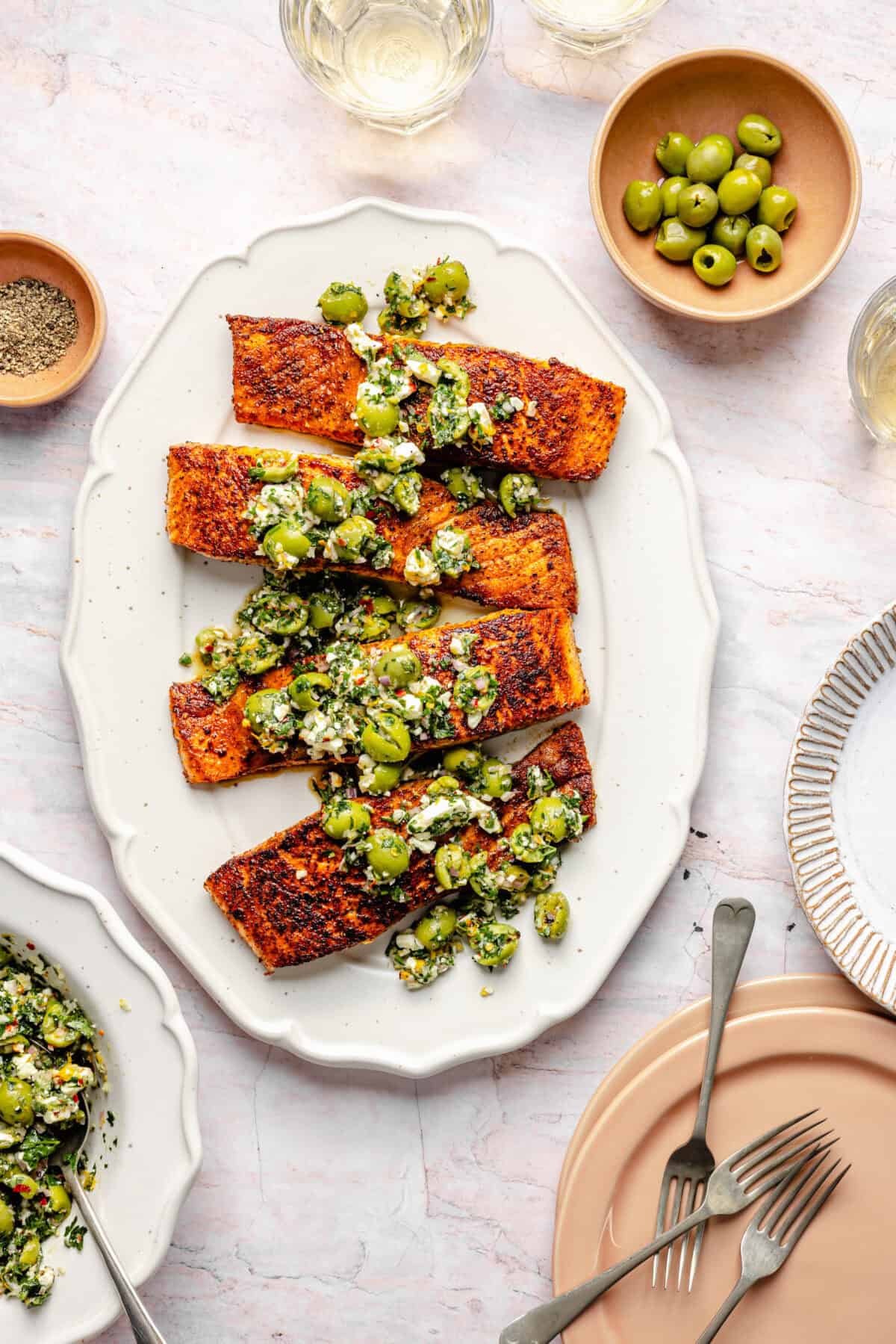 Pan-Seared Salmon with Castelvetrano Olive and Feta Salsa on platter.
