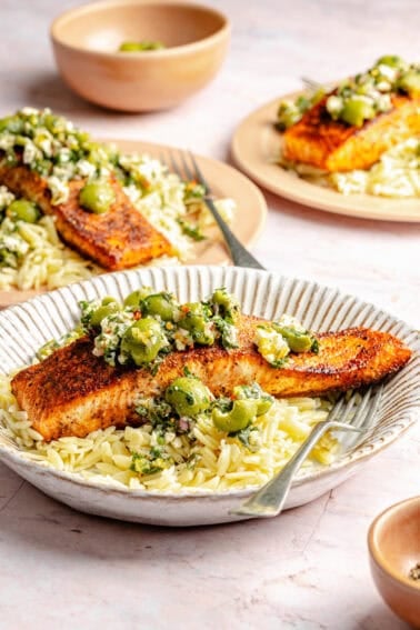 Pan-Seared Salmon with Castelvetrano Olive and Feta Salsa plated with orzo.