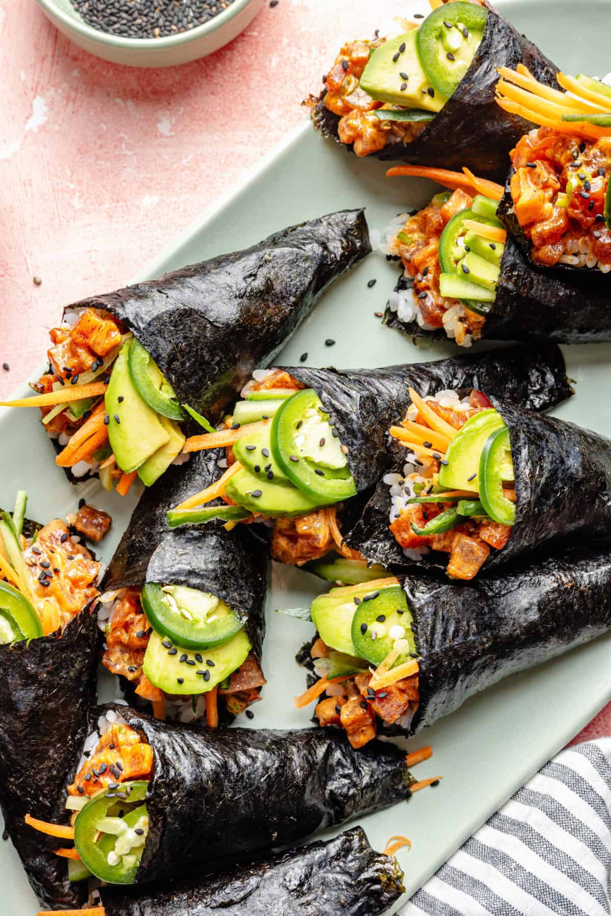 Spicy Tuna Hand rolls on platter.