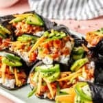 Spicy Tuna Hand rolls on a tray.