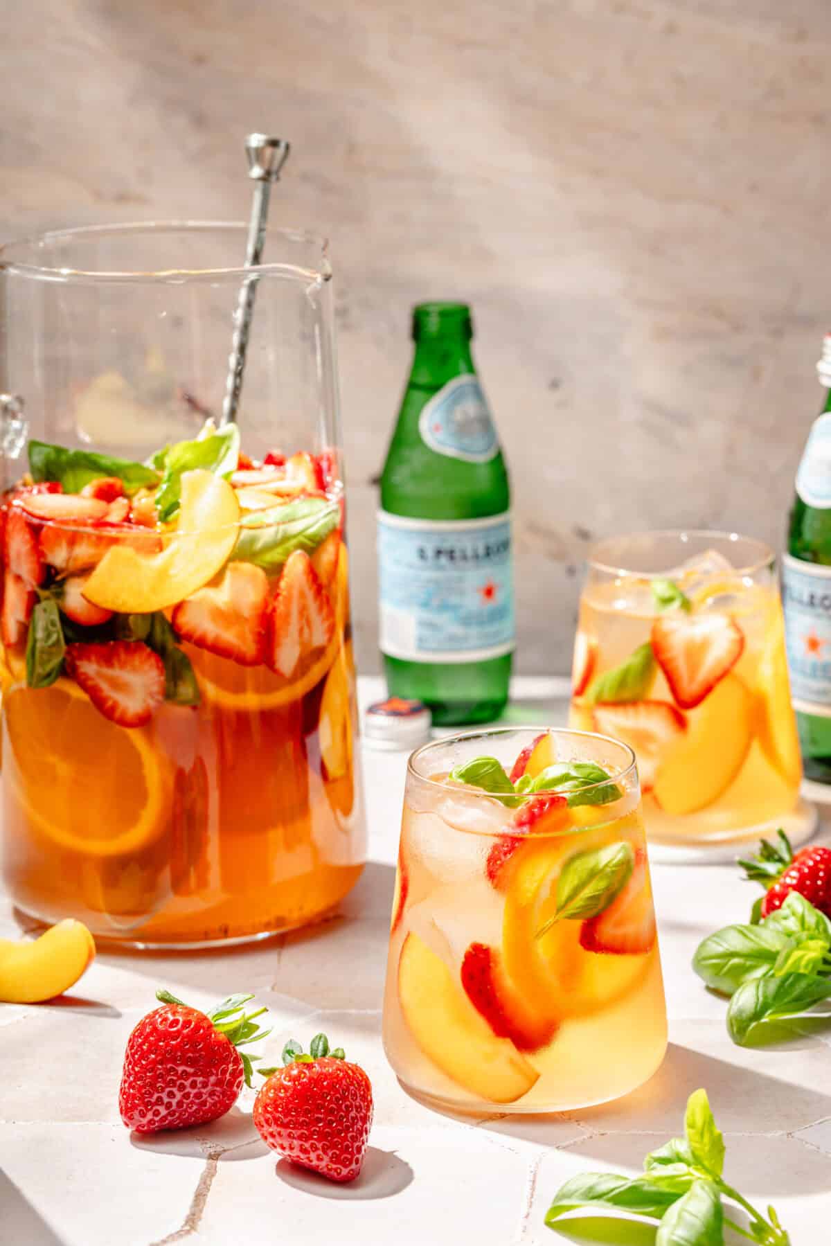 Summer Rosé Sangria in glasses and pitcher