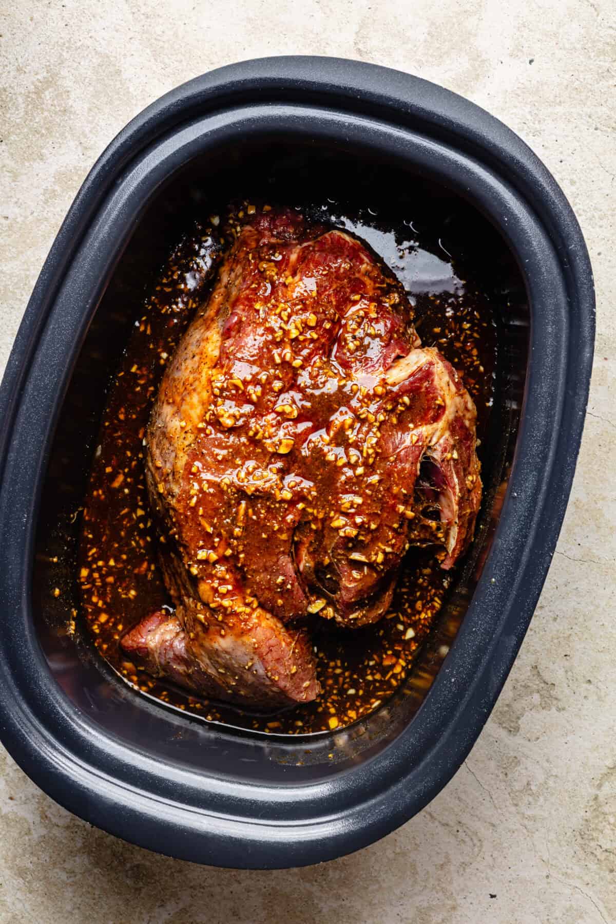 Slow Cooker Miso-Ginger Chuck Roast in slow cooker before it is cooked.