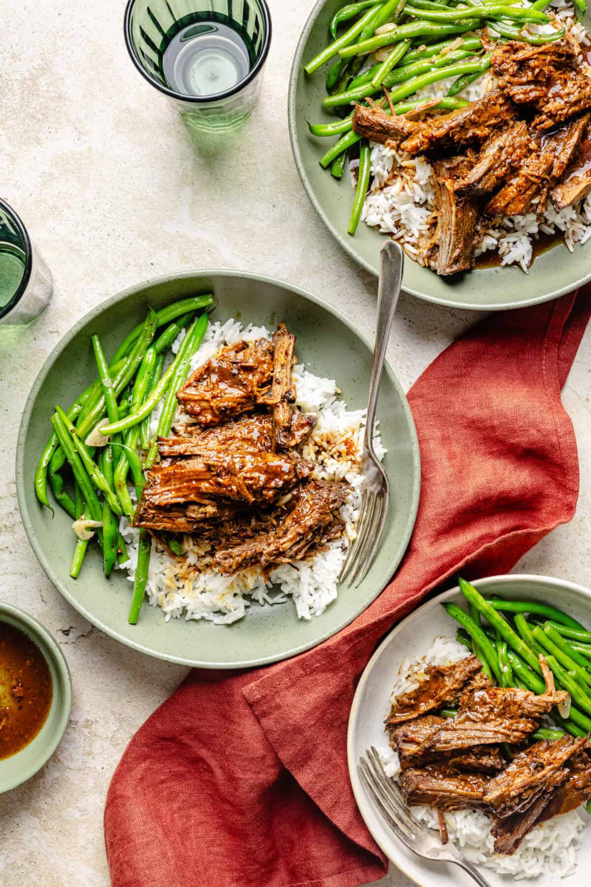Slow Cooker Miso-Ginger Chuck Roast in a bowl over rice with green beans.