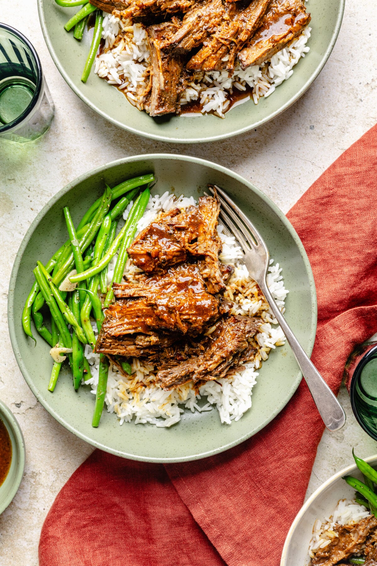 Slow Cooker Miso-Ginger Chuck Roast in a bowl over rice with green beans.