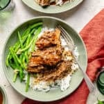 Slow Cooker Miso-Ginger Chuck Roast in a bowl over rice with green beans.