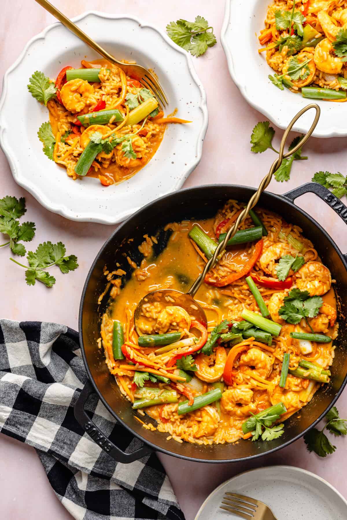 20-Minute Thai-Inspired Coconut Shrimp Curry in skillet and serving bowls.