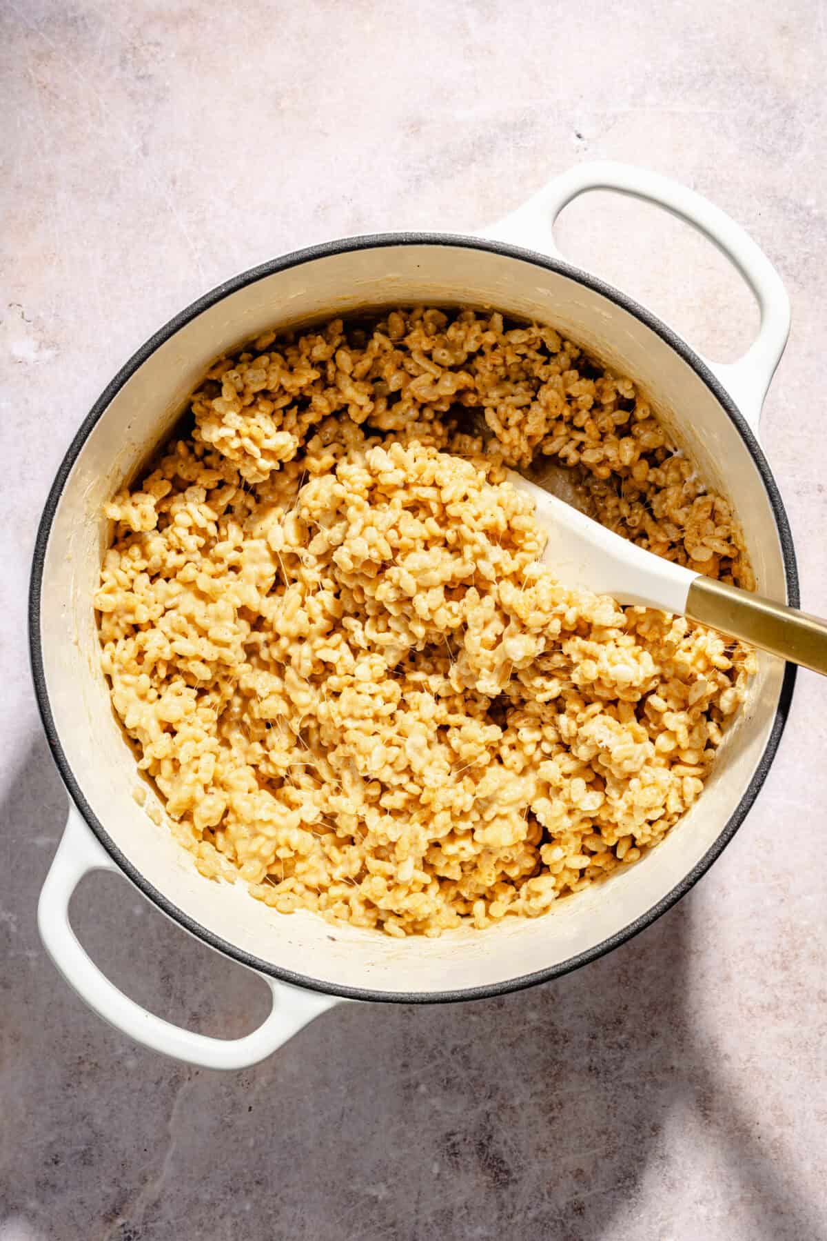 a pot with melted marshmallows and rice cereal