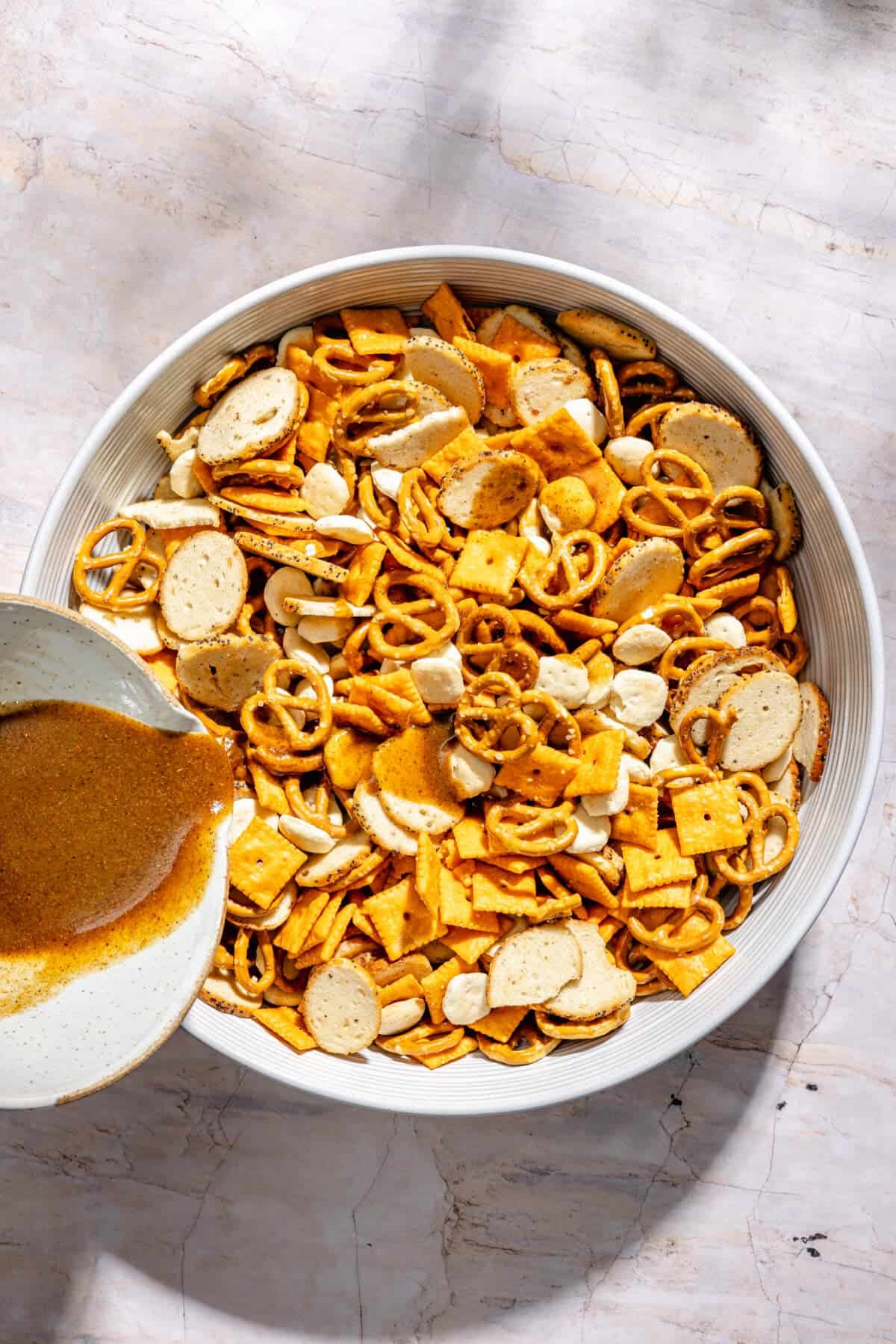 Cajun Cheddar Snack Mix in large mixing bowl.