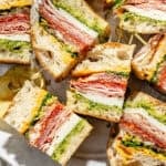 a platter with italian party sub sandwiches