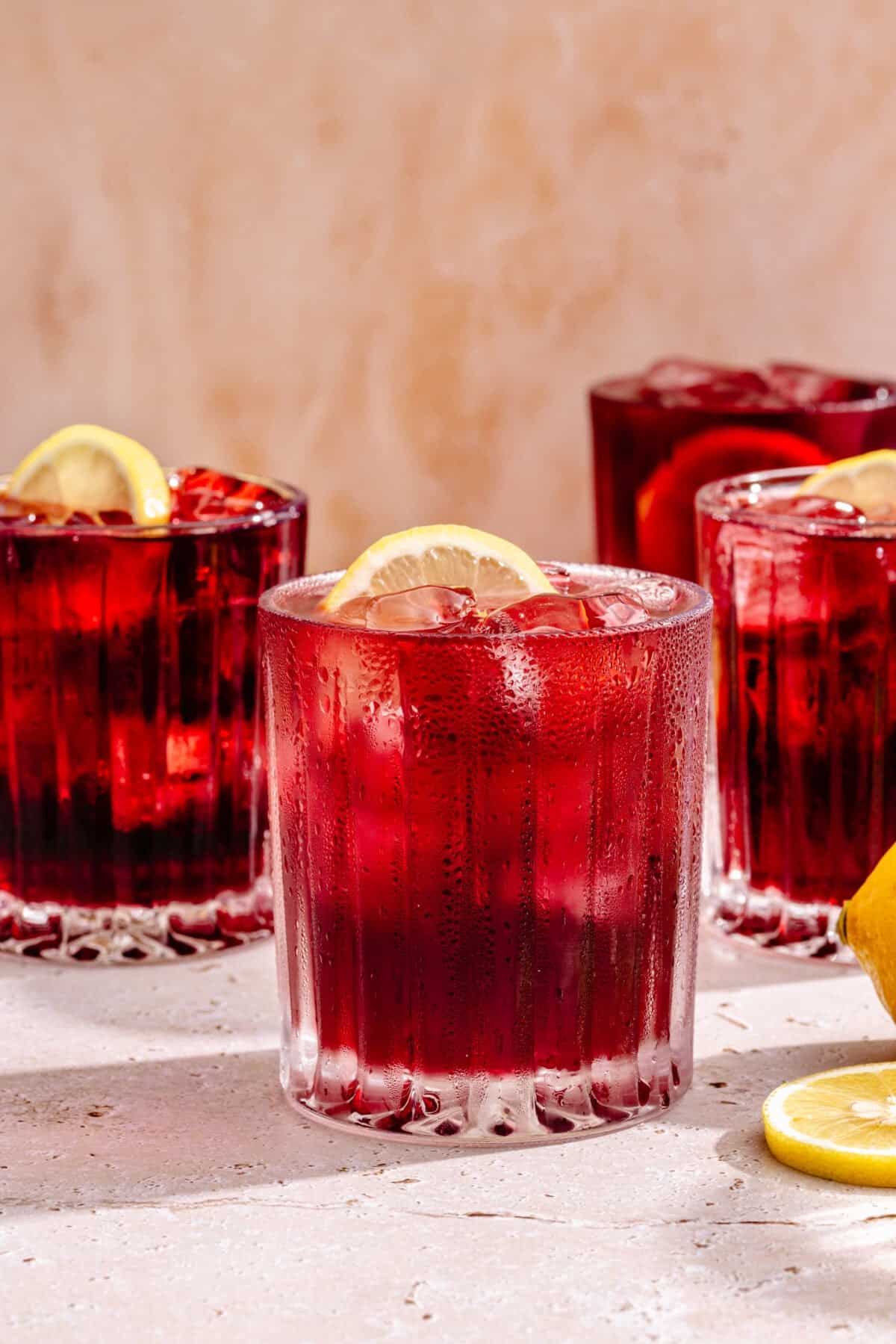 Tinto de Verano in multiple glasses with lemon slices surrounding.