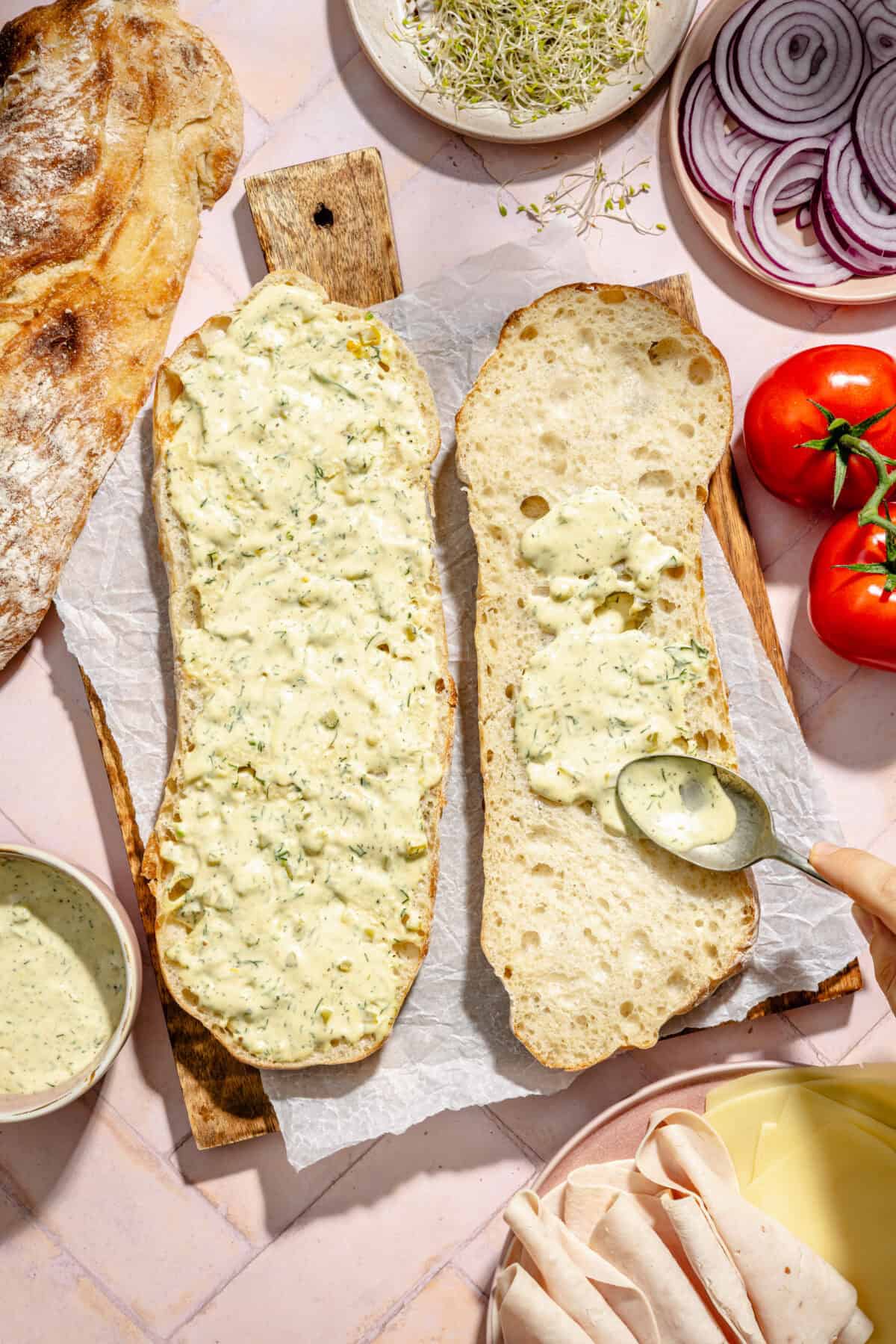 Slice bread with the dill mayo lathered on top.