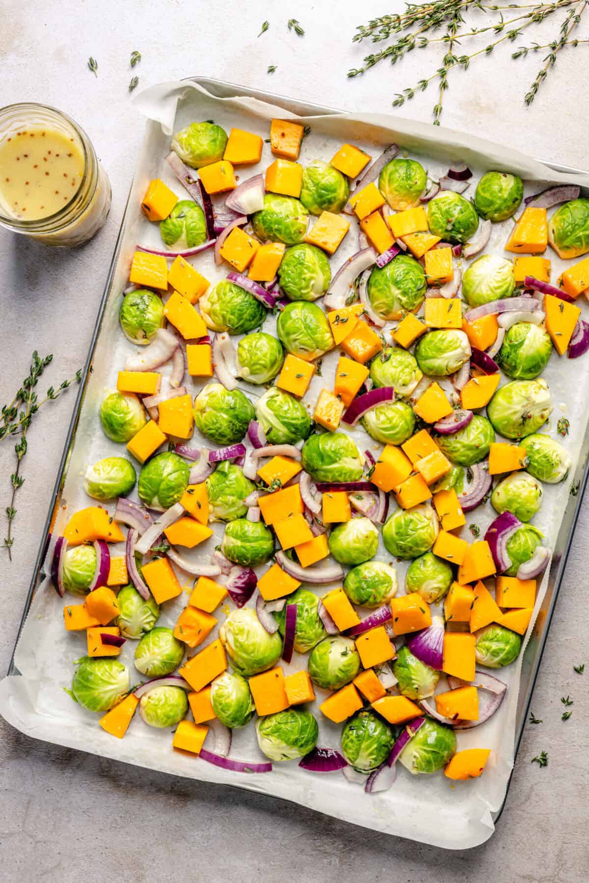 Veggies on sheet pan before roasting. 