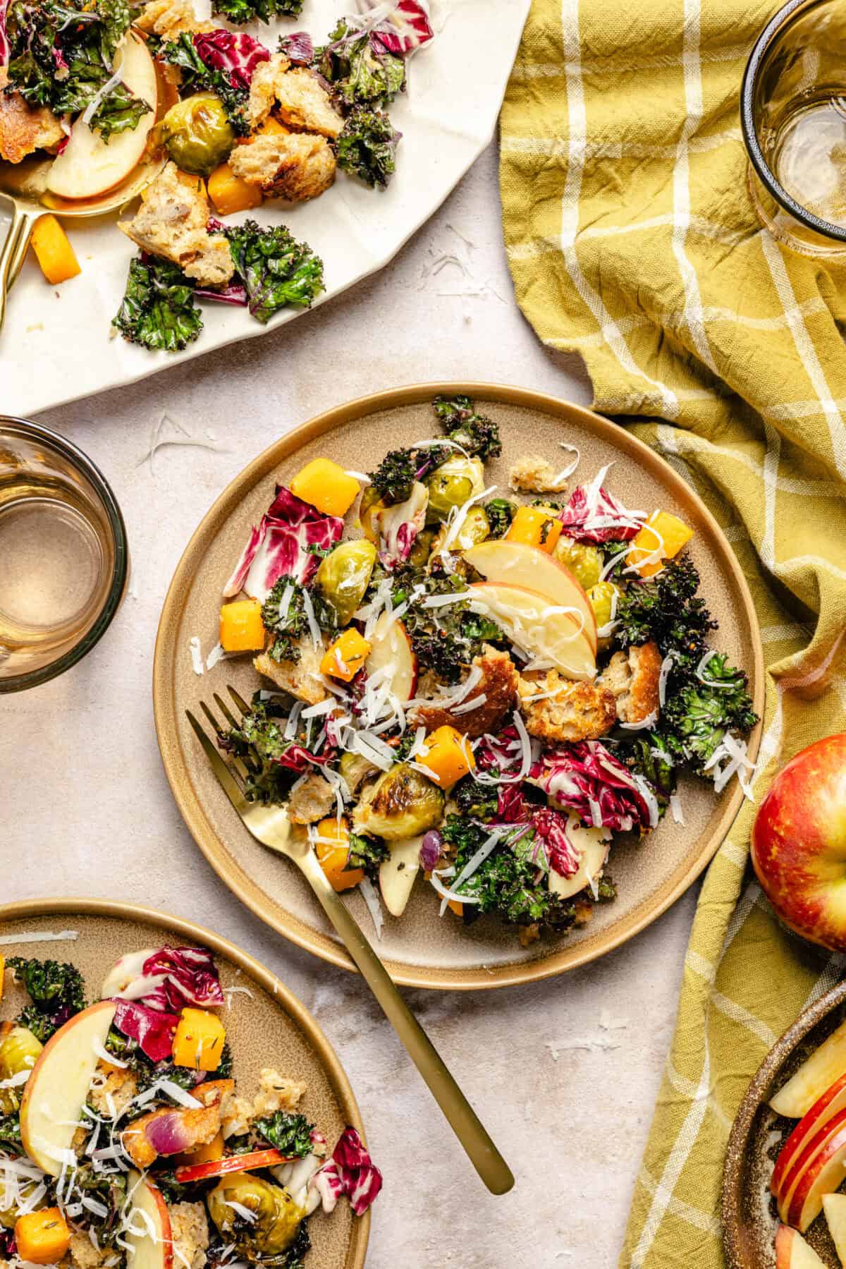 Fall Panzanella Salad with Maple Mustard Vinaigrette on tan plates.